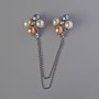 Brooch for cardigans Accent white, yellow, gray beads, silvery metal 22 mm, chain 12 cm