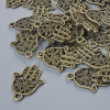 Pendant fittings 'Hamsa', 21×15 mm, hole diameter 1.7 mm, Pack of 24 pcs ±, bronze metal color