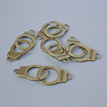 Pendant finding 'Handcuffs', diameter 23x14 mm, thickness 5 mm, hole diameter 2.4 mm, length 40 mm, pack of 5, bronze metal color