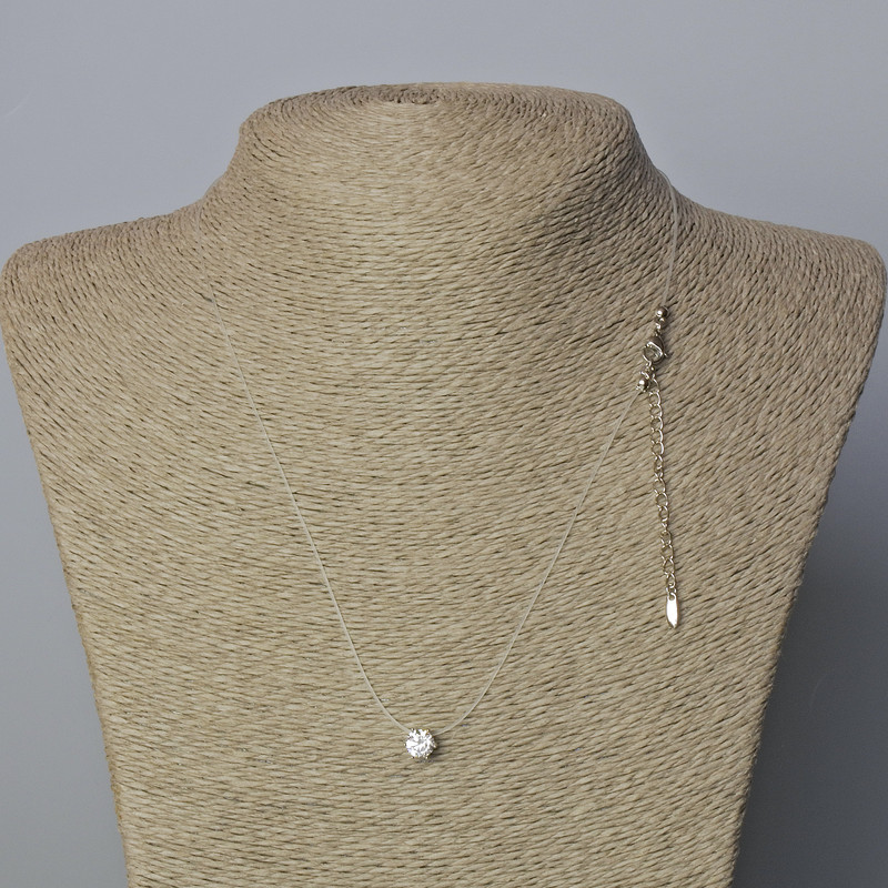 Pendant with white crystal, diameter 6.5 mm, on a thin cord with a clasp, Xuping Rhodium, thickness 0.8 mm, length 45-50 cm