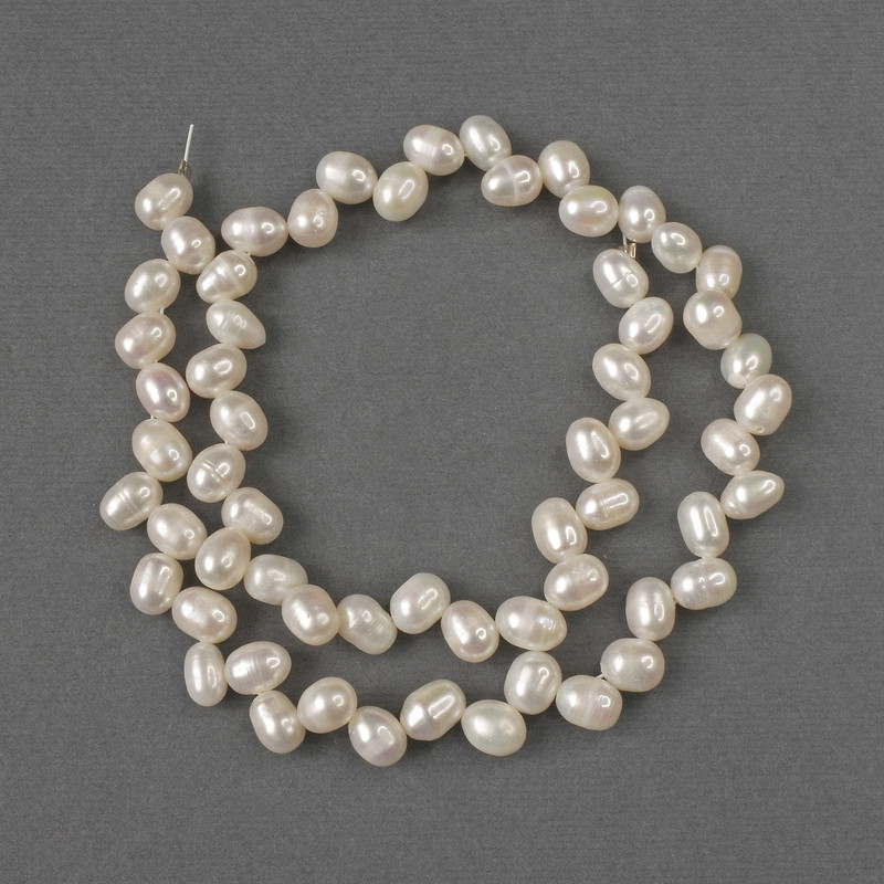Oval natural freshwater pearl beads 8x6 mm, 38 cm long on a thread