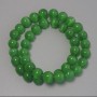 Beads 'Cat's Eye' green synthetic stone smooth round beads, 9.5 mm diameter on beading thread, 38 cm length