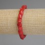 Bracelet with coral faceted beads, 9–14×9 mm, length 18 cm, stretch