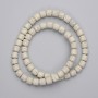 Beige Volcanic Lava Cylindrical Beads, 6.5 mm diameter, on thread, 38 cm length