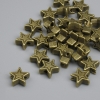 Star-shaped bead insert in antique bronze color, 6×2.5 mm, hole diameter 1.5 mm ±, packaging ~25 pcs.