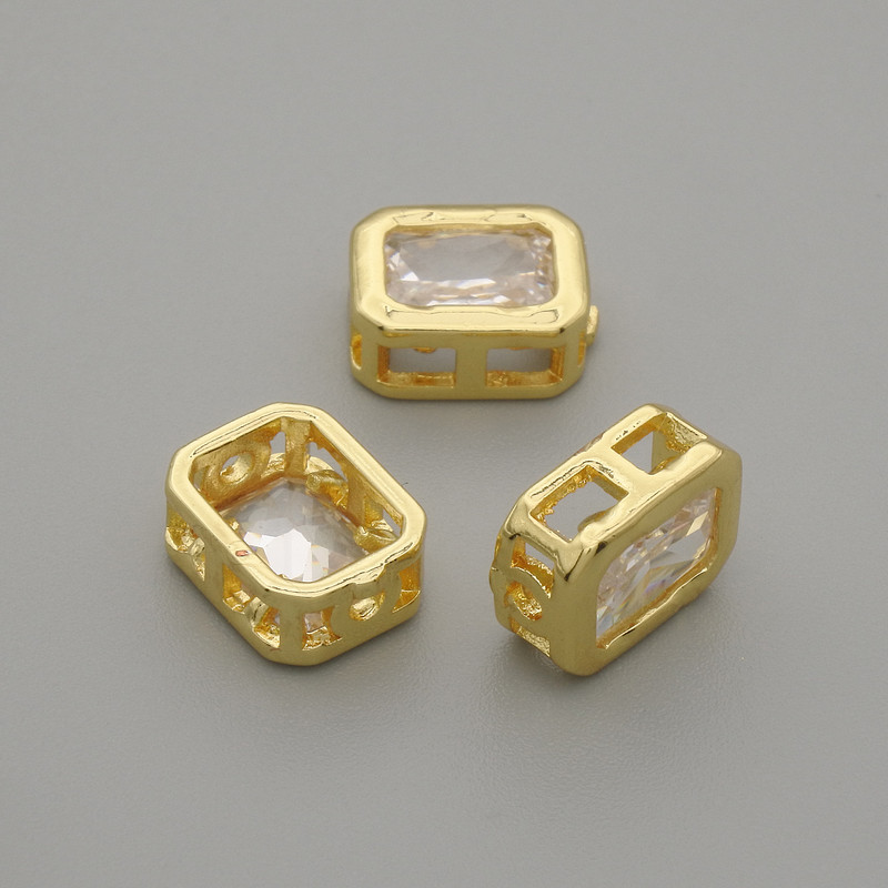 Bead insert with white crystal in gold-tone metal, 9×7 mm, hole diameter about 1.3 mm, per piece