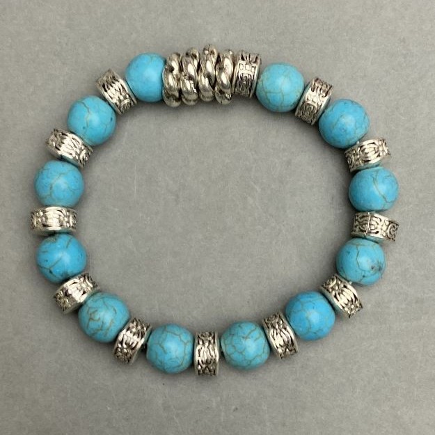 Elastic turquoise bracelet, diameter 10 mm (±) with metal inserts, length 18 cm +