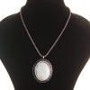 Pendant on chain with large dark gray mother-of-pearl, metal Greek setting with crystals, oval 45×55 mm, length 46–56 cm