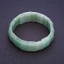 Jade bracelet on elastic with rectangular links measuring 2.5 × 1.1 cm