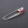 Brooch pin with red glass crystals, 66×15 mm, white metal
