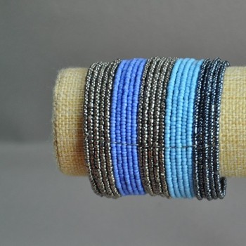 Beaded bracelet with clamp closure in purple-blue-gray