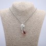 Pendant 'Bird with a Ball' 47×18 mm on a chain, length 70 cm, silver-toned metal