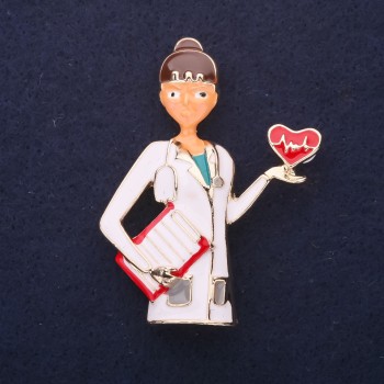 Brooch 'Doctor' enamel in white and red colors, 50x38 mm, gold-tone metal
