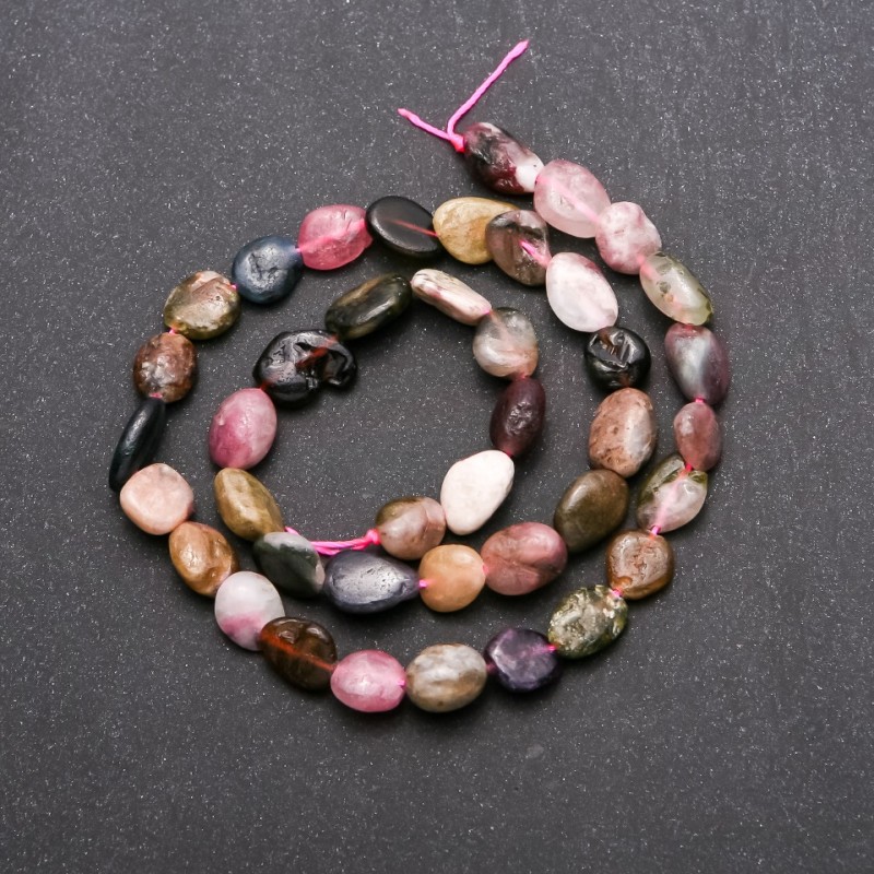 Tourmaline beads on thread, faceted, 8x10 mm (+/-) diameter, length 38 cm