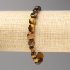 Tiger's Eye Stone Bracelet - Faceted, 8x8 mm diameter ± on elastic, length 18 cm