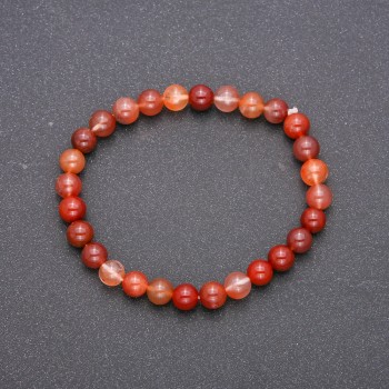 Bracelet made of natural red rutile quartz on elastic cord, smooth beads, diameter 6(±)mm, length 18cm