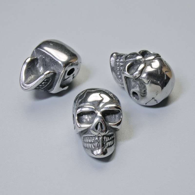 Bead-inlay 'Skull', diameter 14×9.5 mm, 5 mm +/-, hole diameter 1.8 mm, silver-colored metal, 1 pc