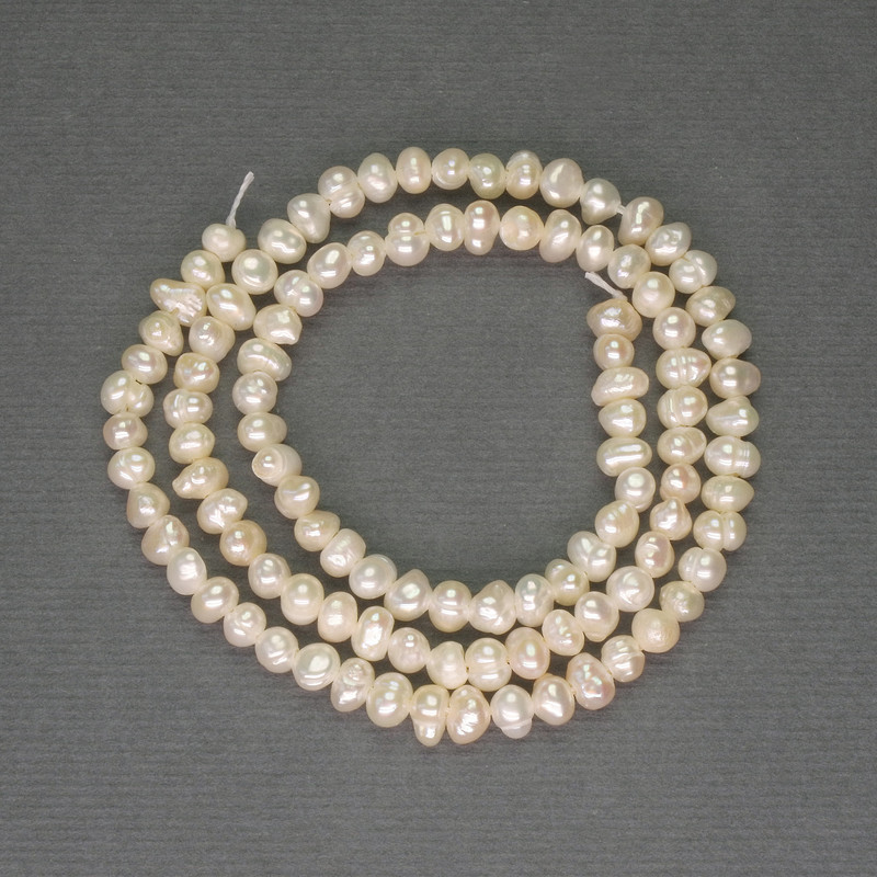 Freshwater white oval pearls on a thread, diameter 3x4 mm ± on thread, length 34 cm ±