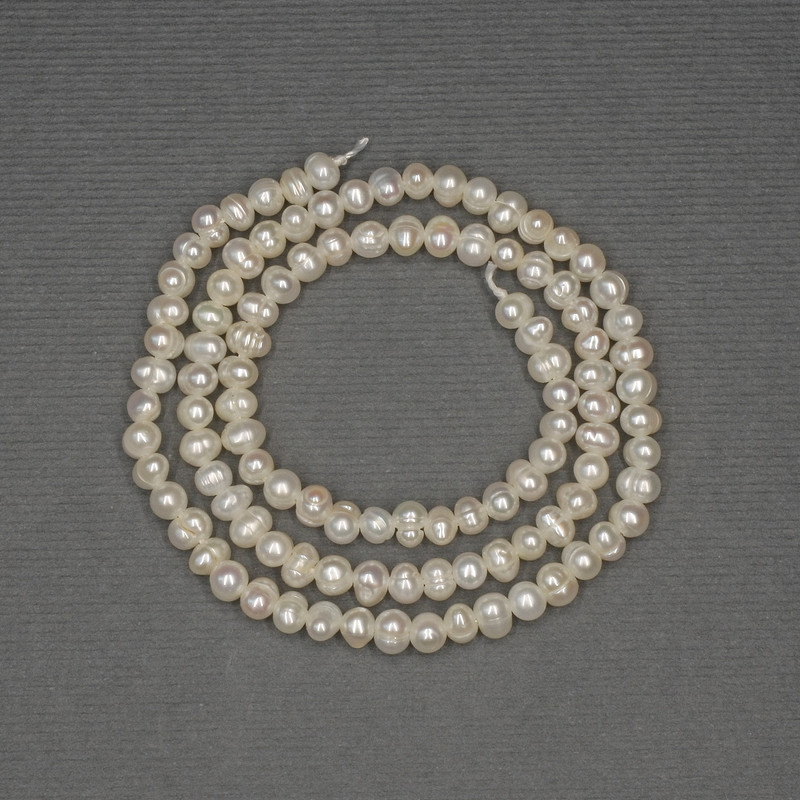 Freshwater white oval pearls on a thread, diameter 4×3 mm, length about 35 cm
