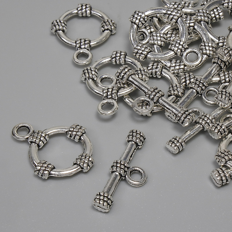 Toggle clasp hardware, diameter 19.5×3.5 mm; circle diameter approx. 14 mm; hole diameter 9 mm; silver-colored metal; fatovka 11 pcs