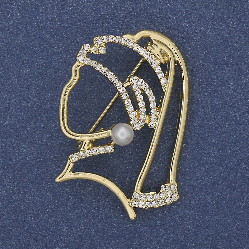 Brooch 'Girl with a Pearl Earring' with white rhinestones, golden metal 39x29mm+