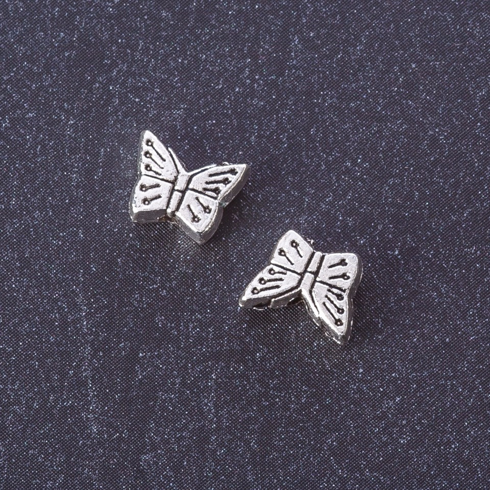 Bead-insert 'Butterfly', metal color 'silver', dia 7x9 mm, packaging 20 g +/- 33 pcs