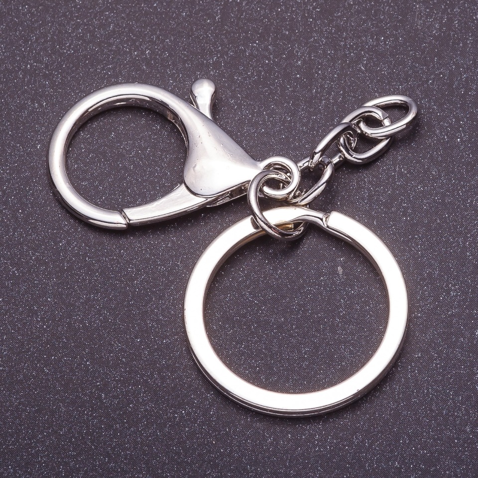 Price per pack / 10 pcs. Keychain base with two attachments: carabiner + ring, diameter 3 cm, length 5 cm