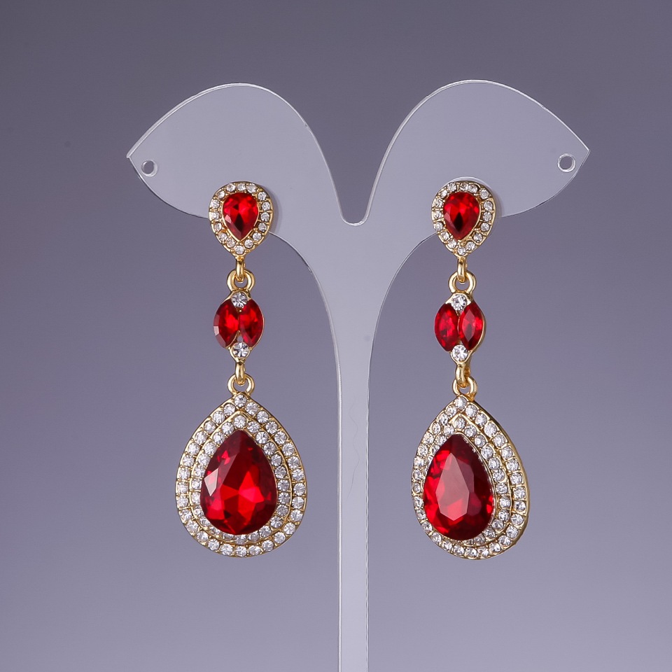 Earrings with red crystals, 6 cm long, yellow metal