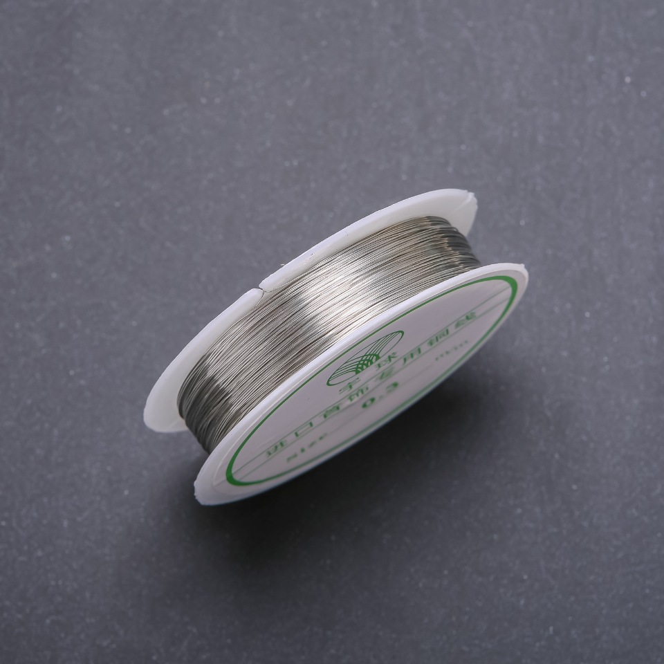 Silver-colored jewelry wire, 0.3 mm diameter, on a spool, 14 m long