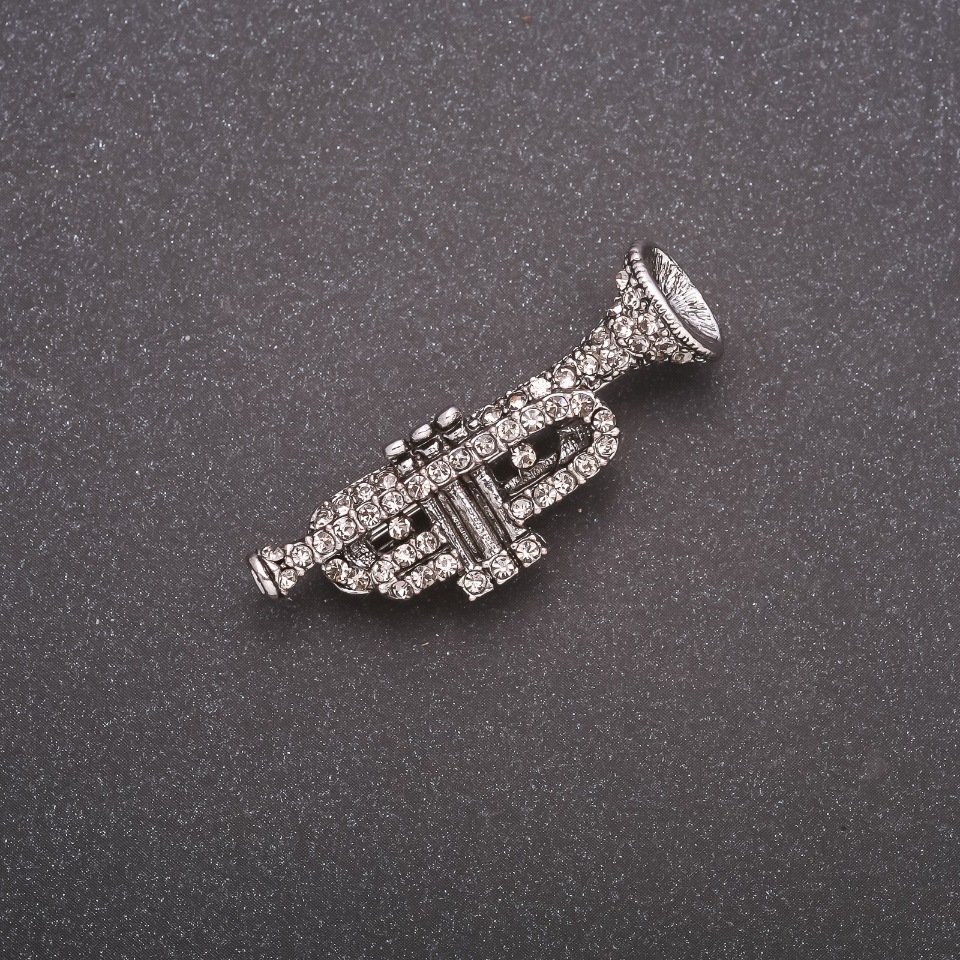 Brooch 'Trumpet' in Rhinestones, Gray Metal, 42x14 mm