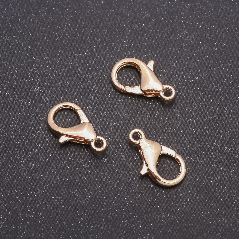 Price per pack / 10 pcs. Clasp 14x8 mm in metal color 'Light Bronze' (1 pc.)