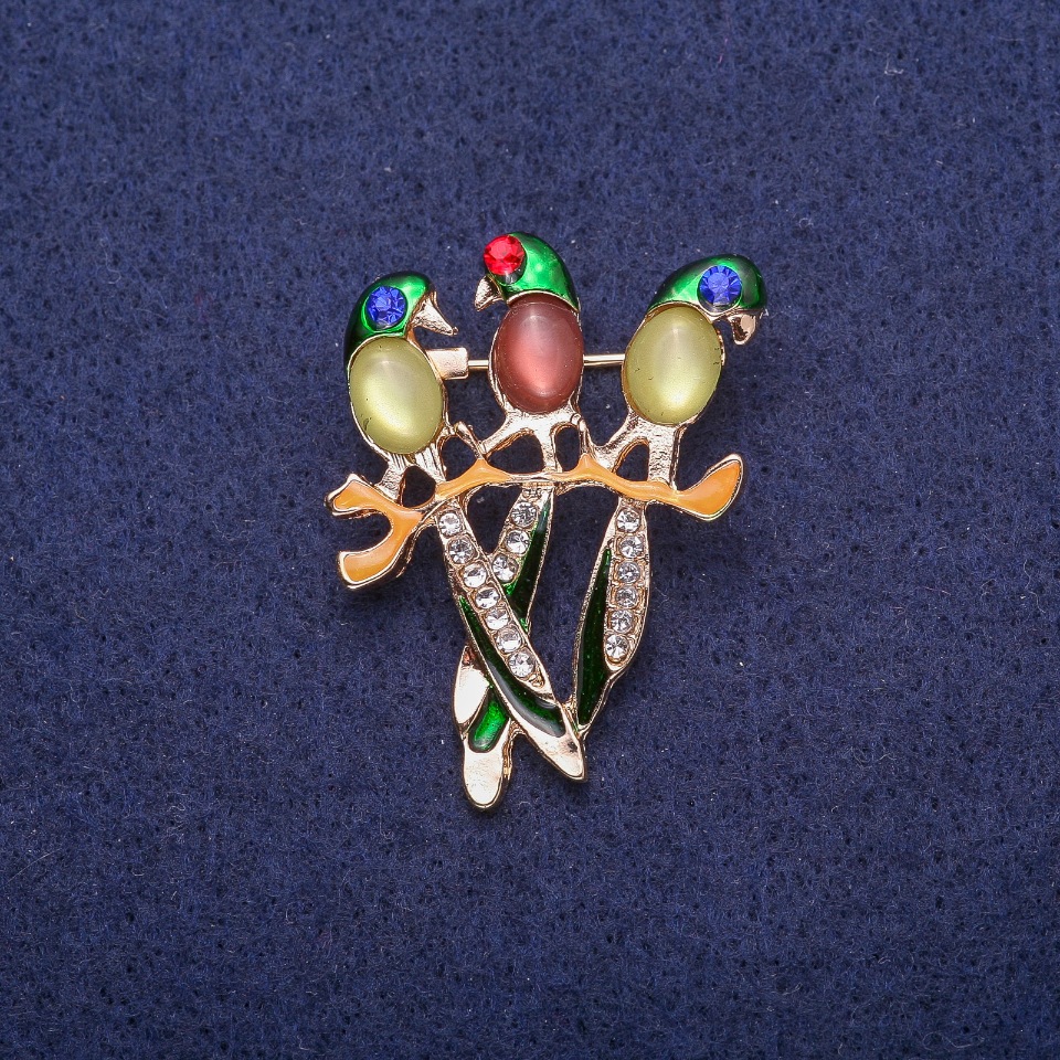 Brooch 'Parrots with Cat's Eye Cabochon', golden metal 30x39mm
