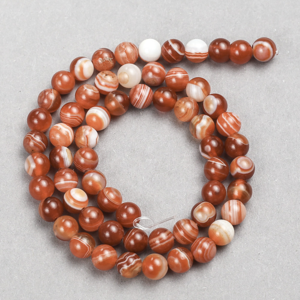 Orange Beads on a String. Smooth round agate beads, 10 mm diameter, 38 cm length.