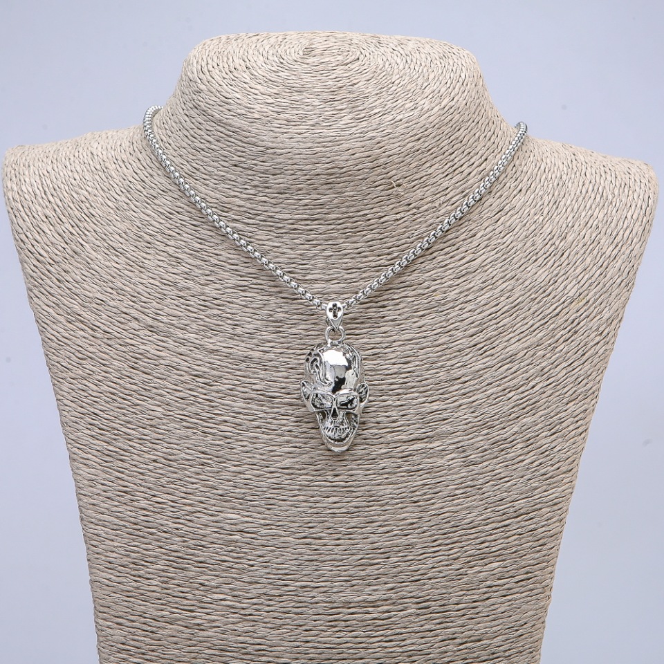 Skull pendant 37×15 mm on a chain, 65 cm length, silver-colored metal