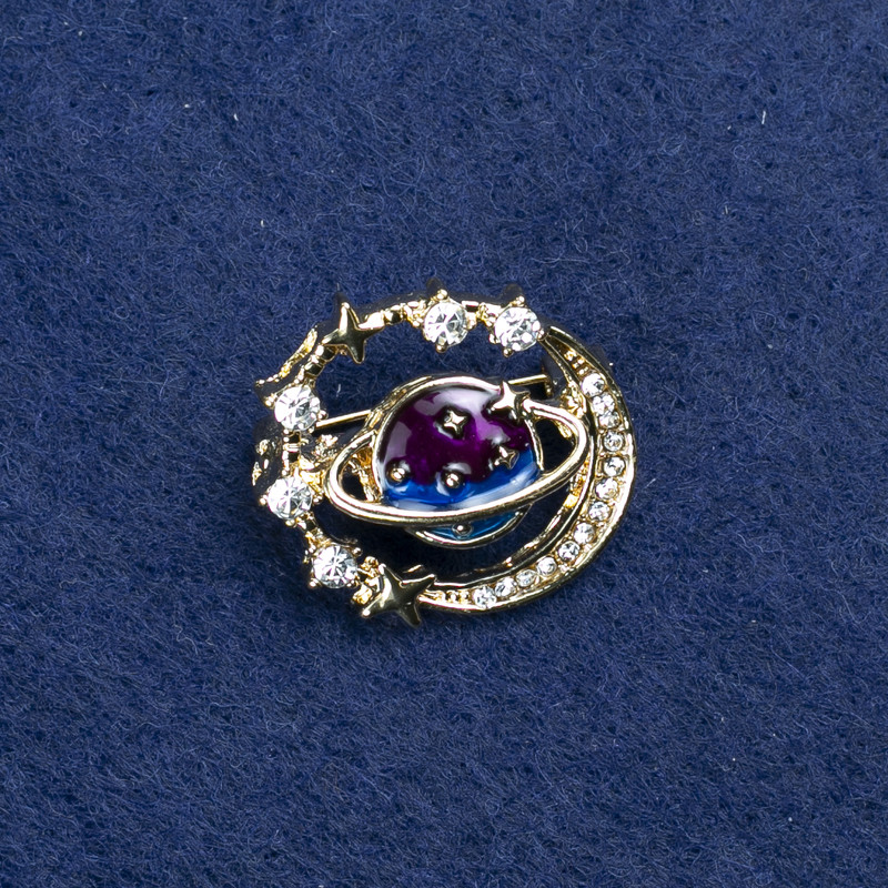 Planet Brooch in golden metal, enamel and crystals, 22×24 mm +
