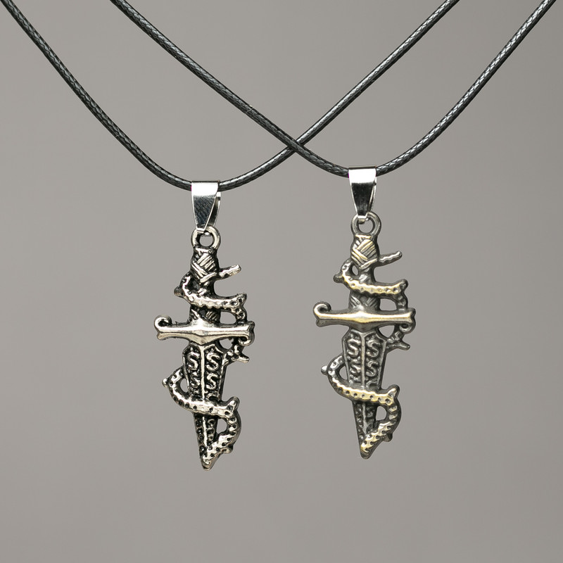 Pair of Dagger pendants on cord 47x16 mm + -, length 45-50 cm