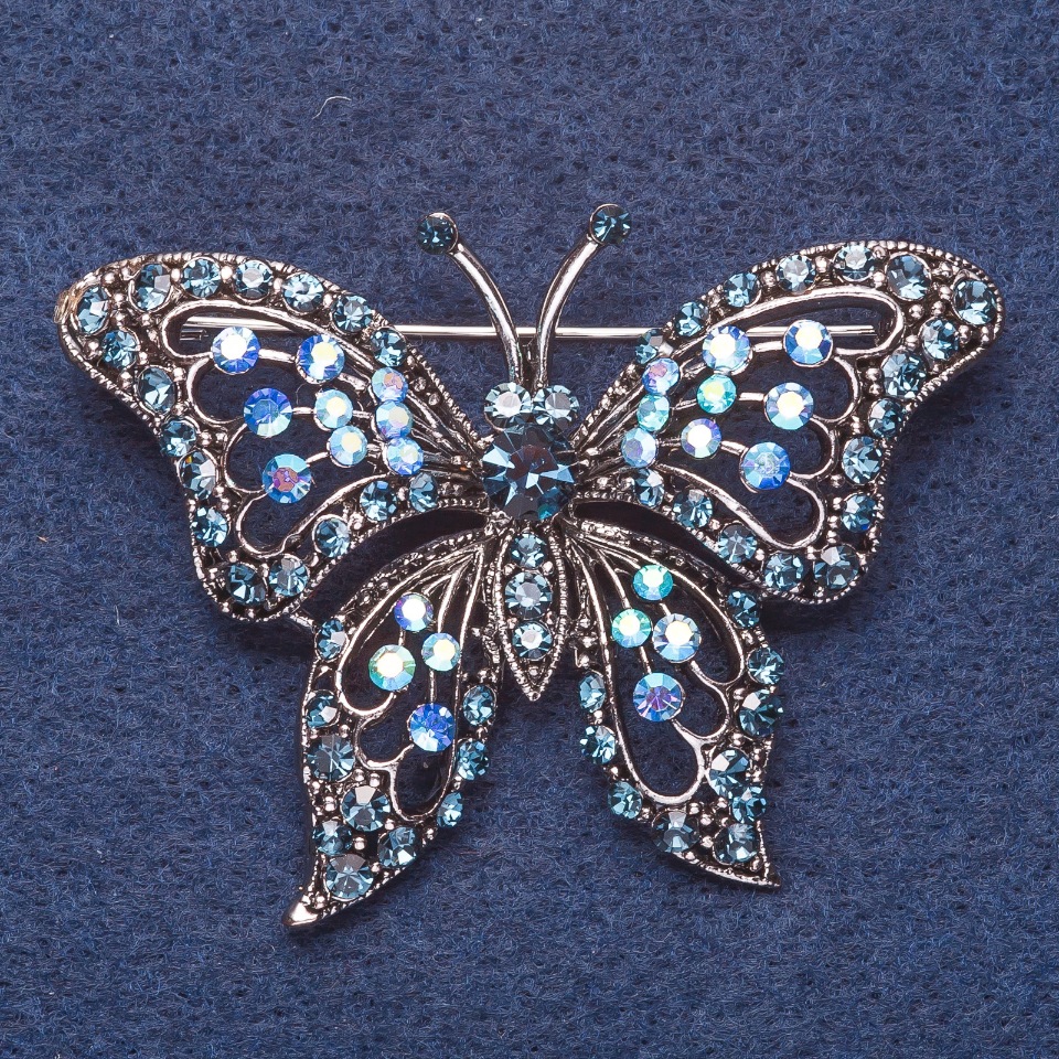 Brooch 'Butterfly' with blue chameleon crystals, silver-tone metal, 6×4 cm