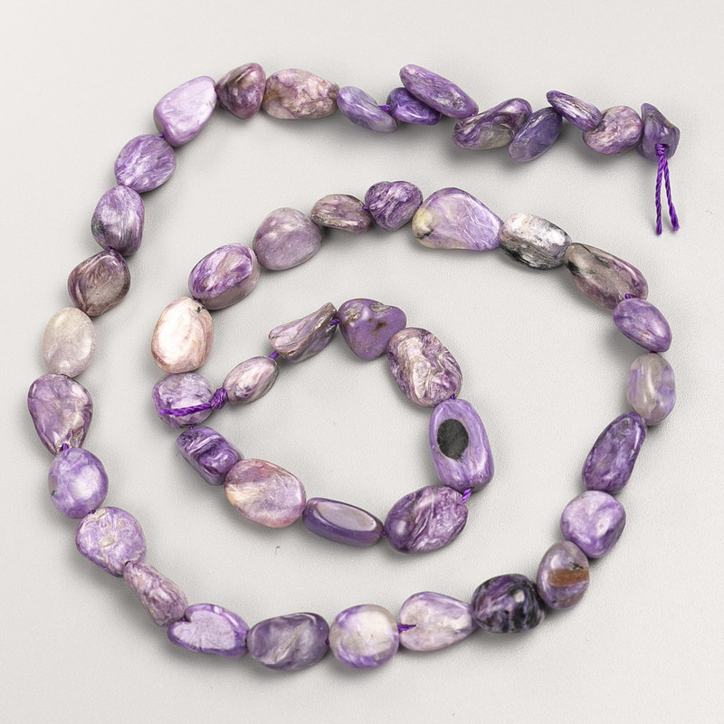 Faceted natural charoite beads on thread, diameter 8x10 mm, length 40 cm